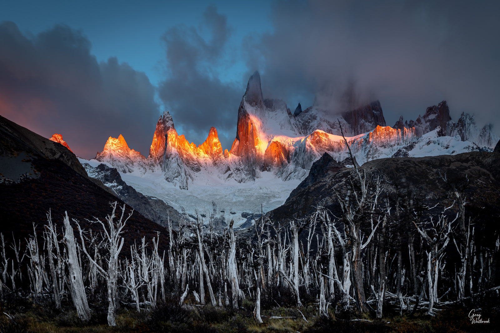 Snowy mountain landscape with glowing peaks at night